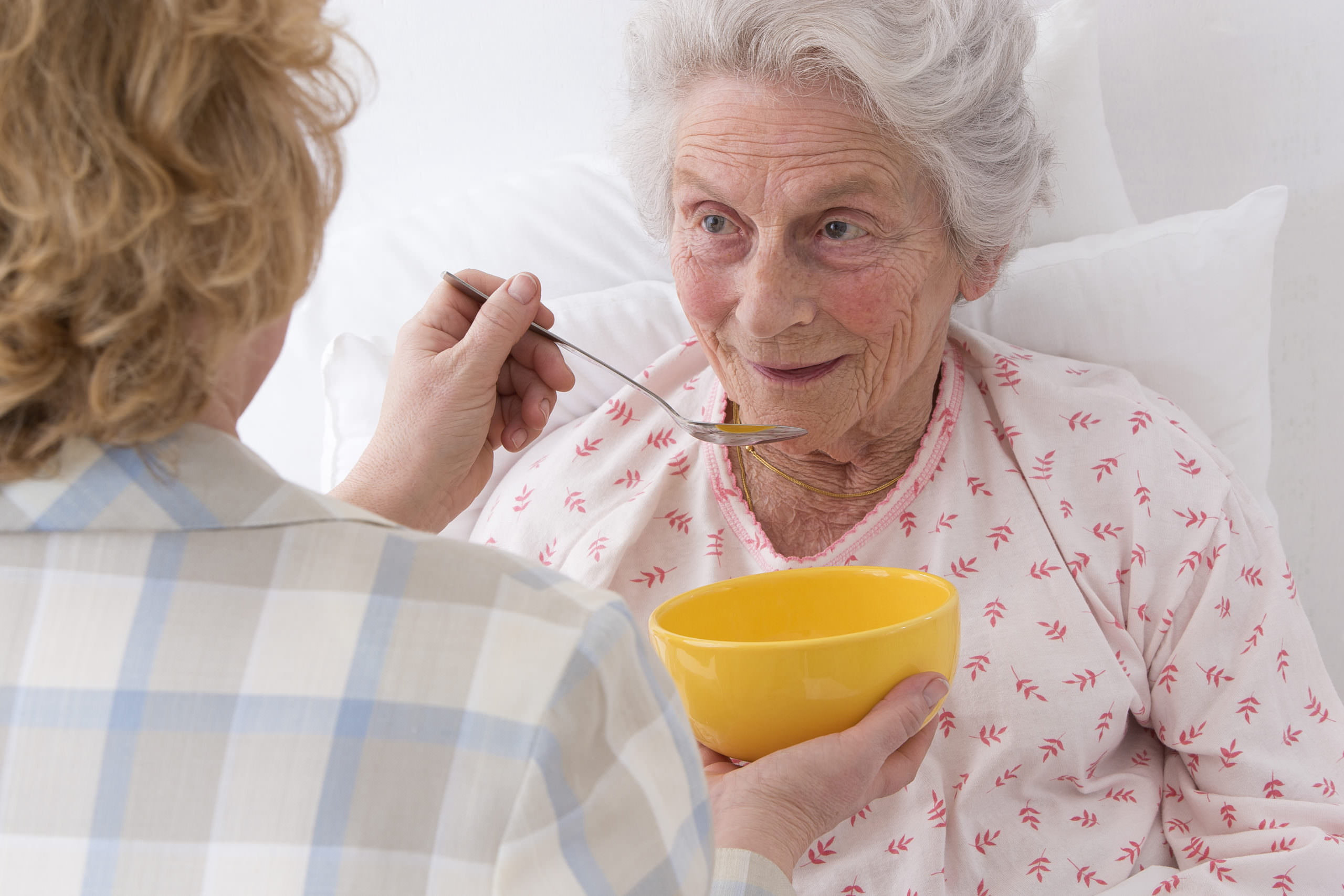 Smiling older woman in a warm, welcoming portrait